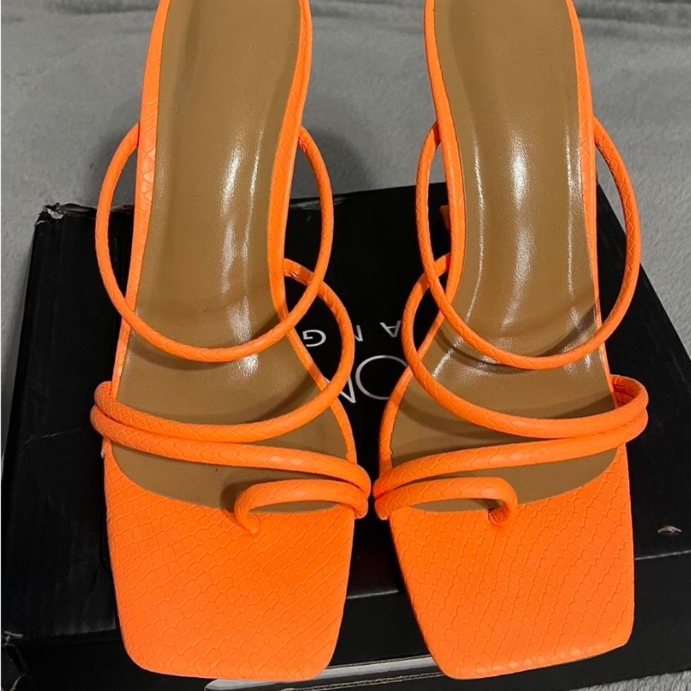 orange heels in a size US 8 women’s. Only worn one time, perfect condition.